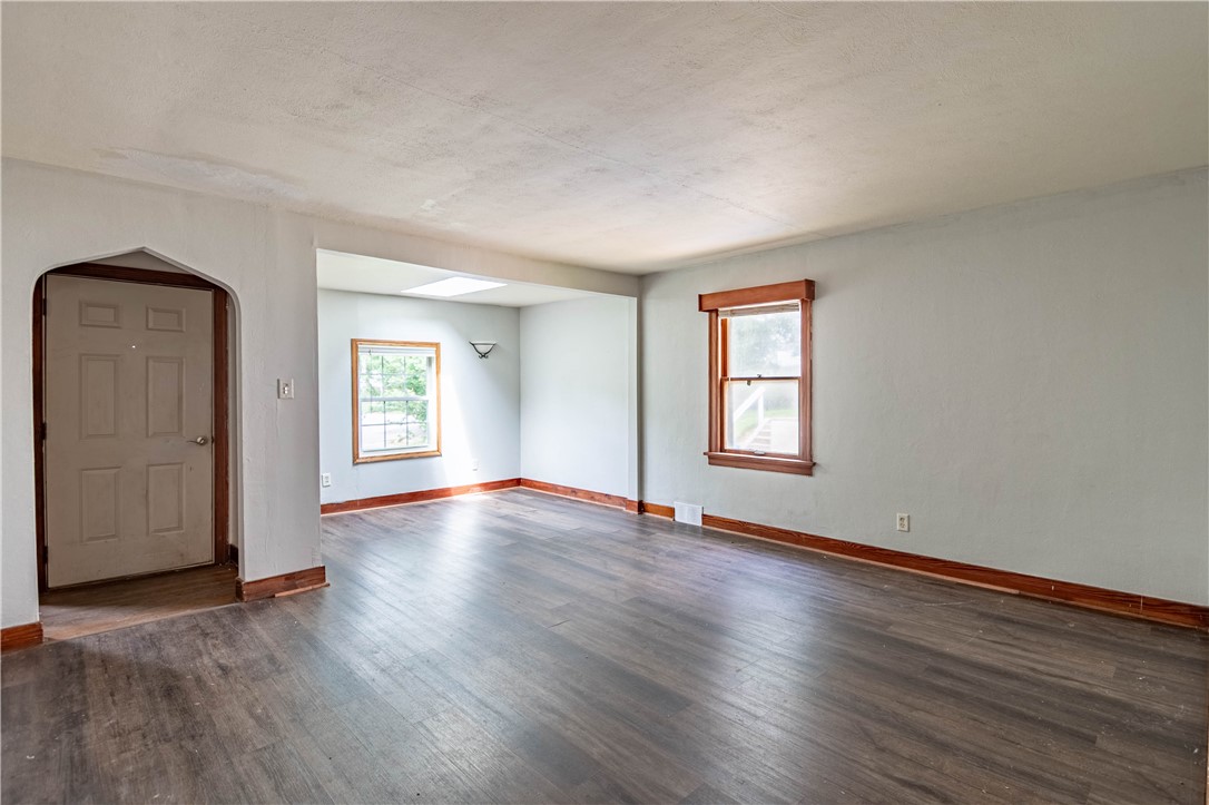 550 Sheridan Drive Decatur, IL 62521 - Photo 4 of 21 an empty room with wooden floor and windows