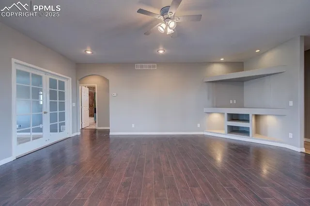 a dining room with furniture and wooden floor
