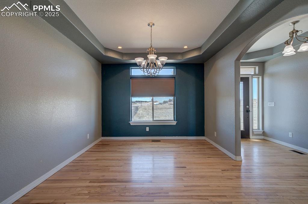 10935 McKissick Road Peyton, CO 80831 - Photo 20 of 50 wooden floor in an empty room with a window