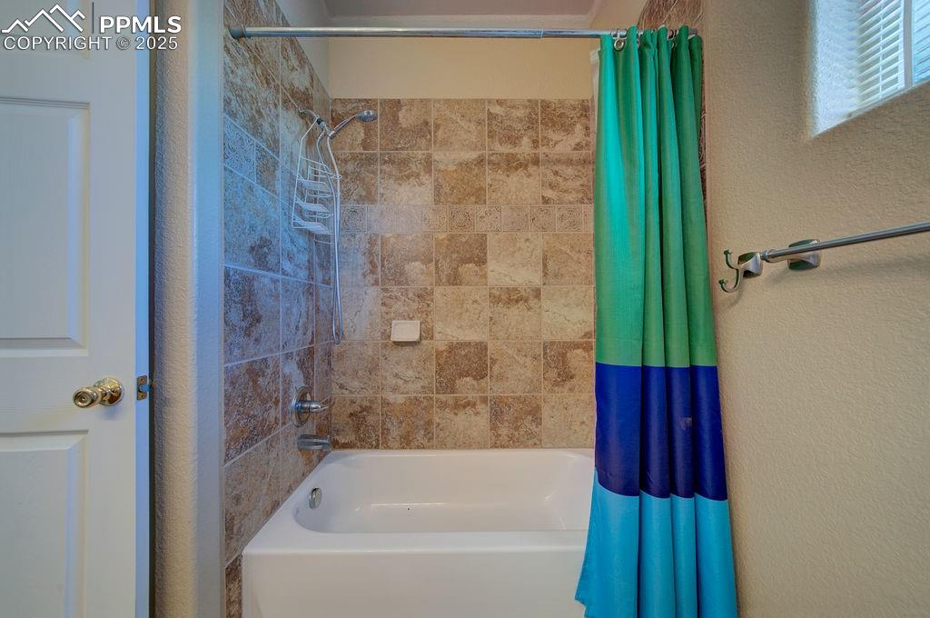 10935 McKissick Road Peyton, CO 80831 - Photo 29 of 50 a bathroom with a shower and a bath tub