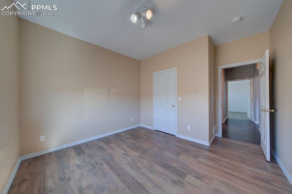 10935 McKissick Road Peyton, CO 80831 - Photo 30 of 50 wooden floor in an empty room
