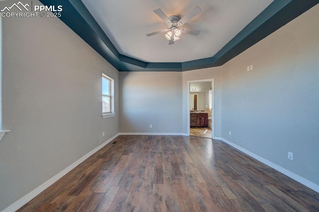 10935 McKissick Road Peyton, CO 80831 - Photo 46 of 50 wooden floor in an empty room with a window