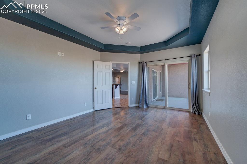 10935 McKissick Road Peyton, CO 80831 - Photo 48 of 50 a view of an empty room with wooden floor