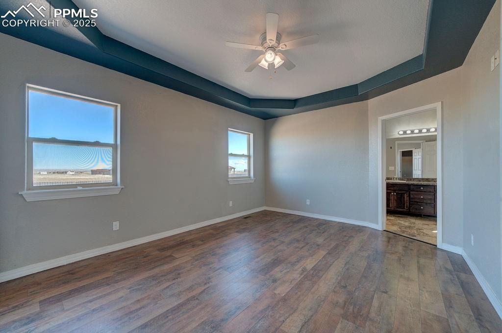 10935 McKissick Road Peyton, CO 80831 - Photo 49 of 50 a view of an empty room with a window and wooden floor