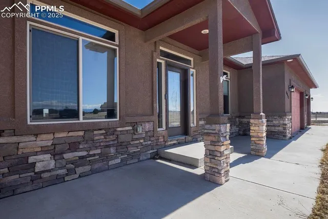 a lobby with furniture and window