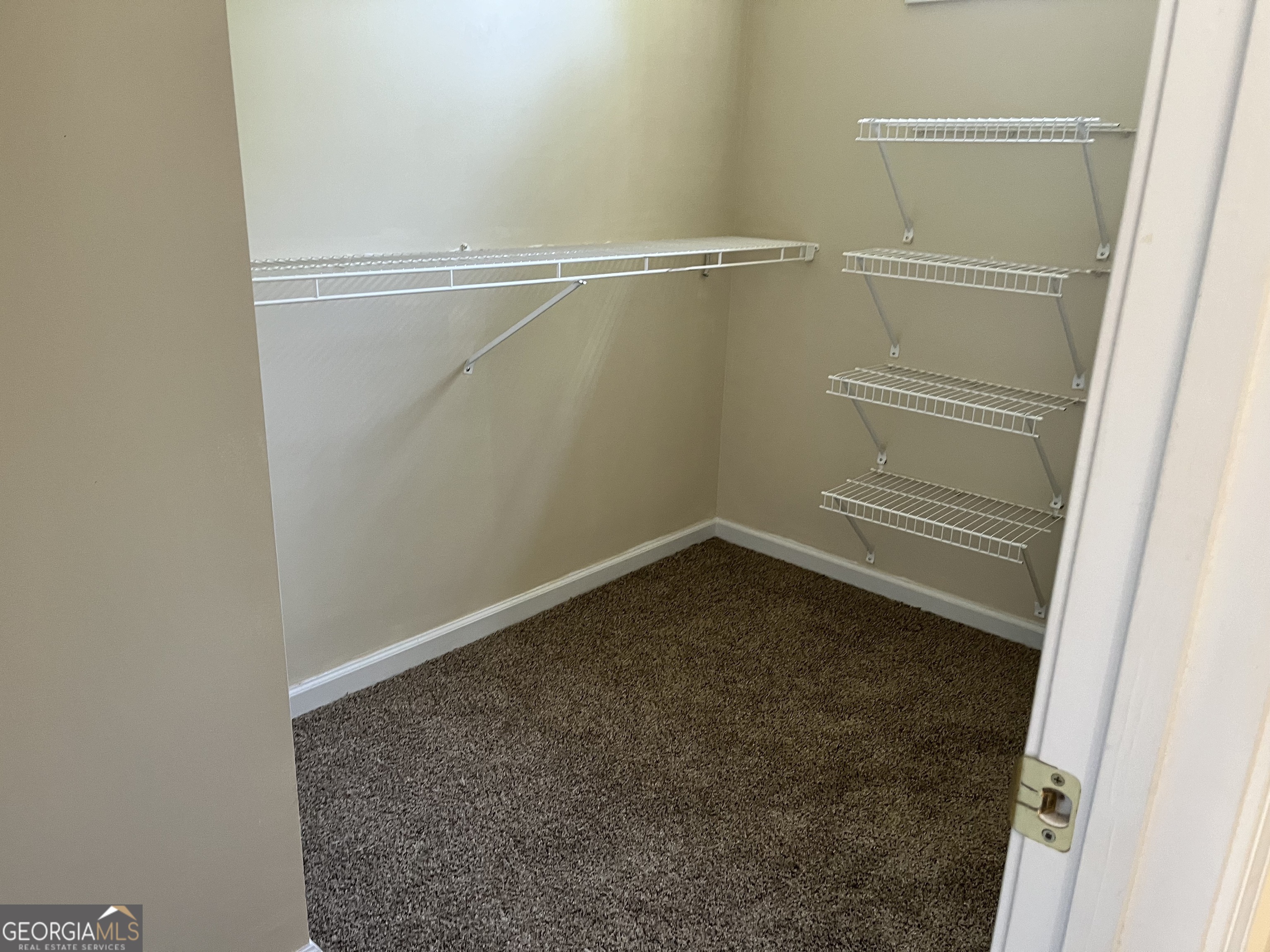 99 High Point North Newnan, GA 30265 - Photo 19 of 33 a view of a room with racks on the wall