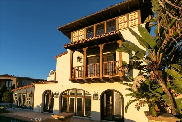 a front view of a house with a lot of windows