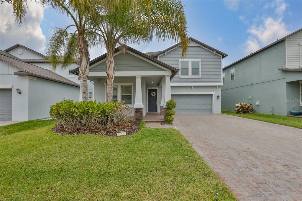 11454 Freshwater Ridge Drive Riverview, FL 33569 - Photo 2 of 65 a front view of a house with garden