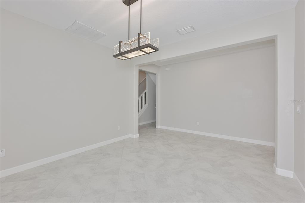11454 Freshwater Ridge Drive Riverview, FL 33569 - Photo 24 of 65 a view of a hallway with a chandelier fan