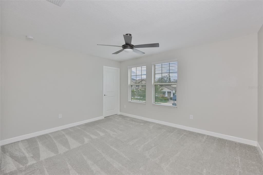 11454 Freshwater Ridge Drive Riverview, FL 33569 - Photo 43 of 65 a view of an empty room with a window
