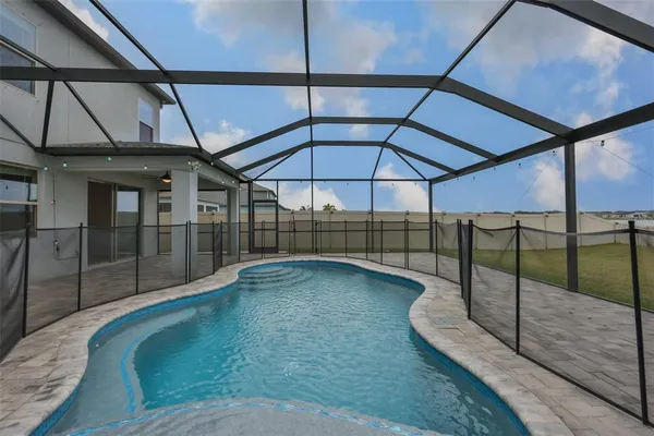 a black and white photo of a book and a bed