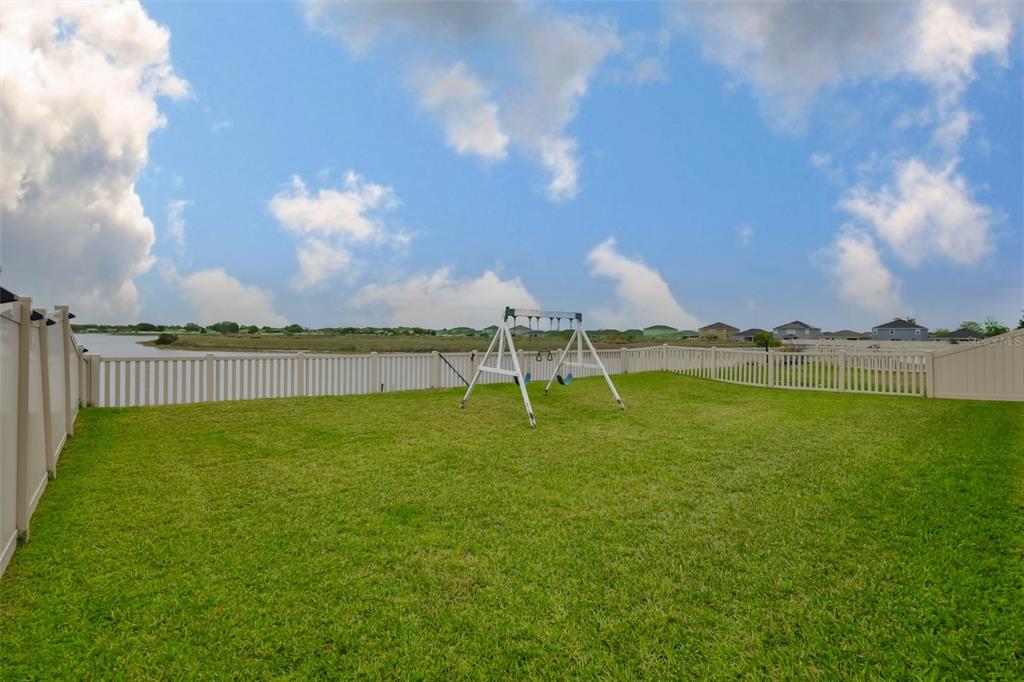 11454 Freshwater Ridge Drive Riverview, FL 33569 - Photo 54 of 65 a view of a lake with houses in the back