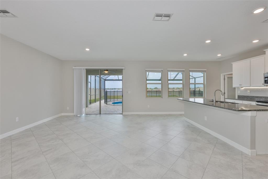 11454 Freshwater Ridge Drive Riverview, FL 33569 - Photo 8 of 65 a view of an empty room with a window