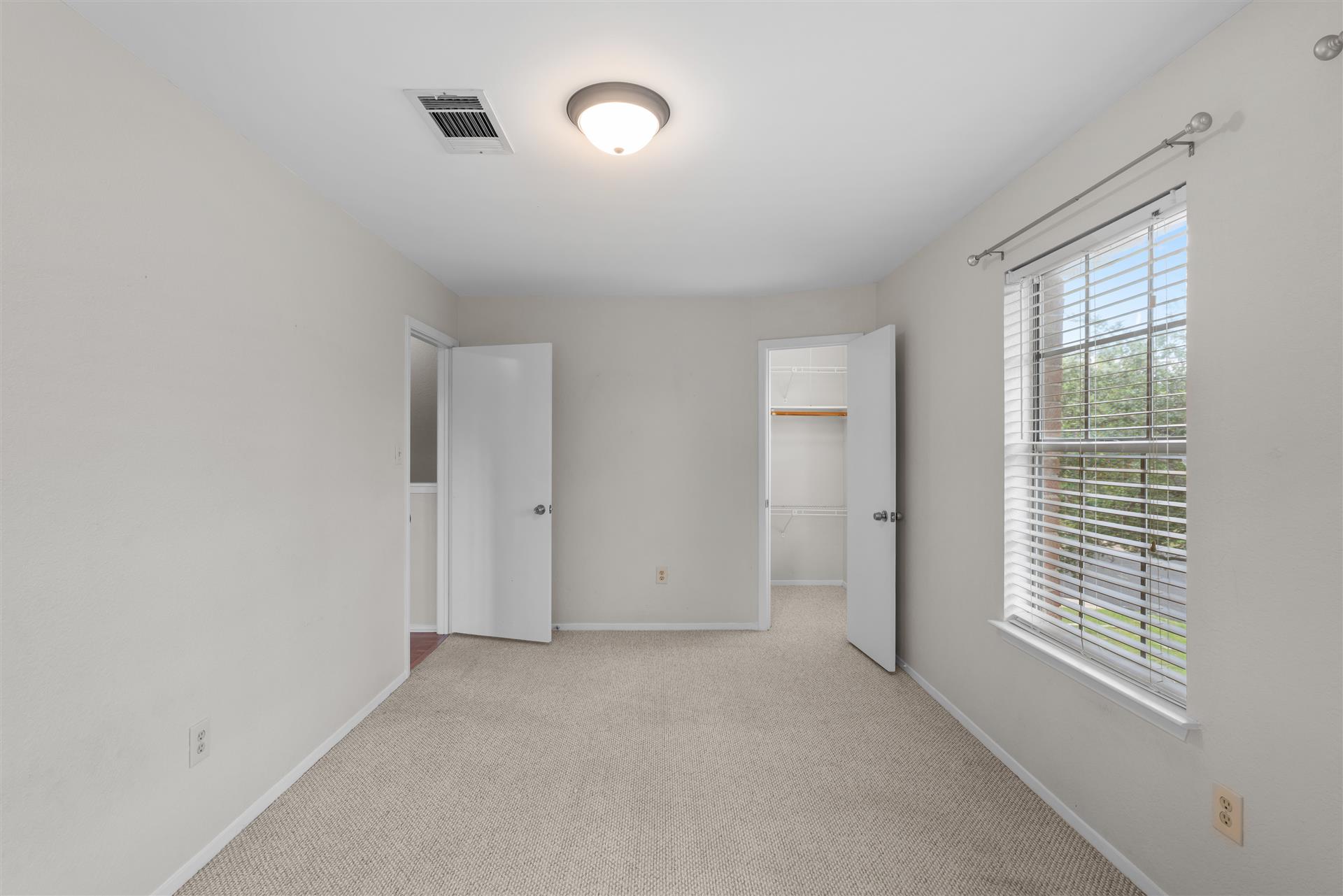 1710 Persimmon Road Cedar Park, TX 78613 - Photo 27 of 33 Secondary bedroom #2 also featuring a walk-in closet,