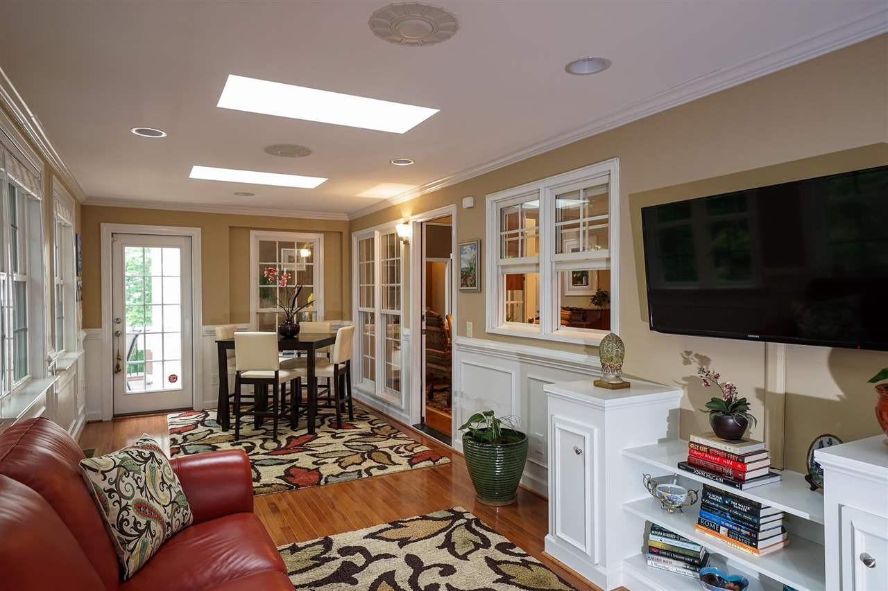 6000 Tiffield Way Wake Forest, NC 27587 - Photo 13 of 30 Permitted sunroom has 3 skylights, hardwoods, and built-ins! Beautiful view! Amazing flex space! Sun Room