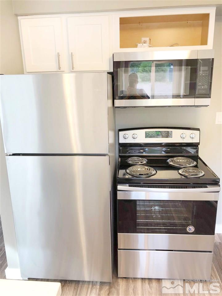 1415 Terrace Reno, NV 89503 - Photo 8 of 19 a stove top oven sitting inside of a kitchen