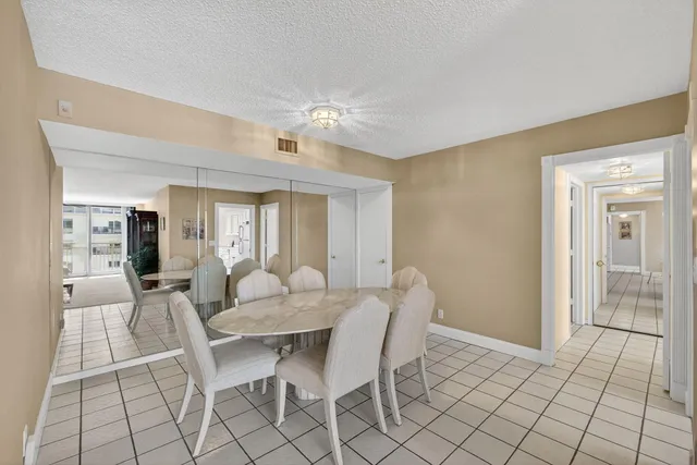 a kitchen with stainless steel appliances granite countertop a sink and a refrigerator