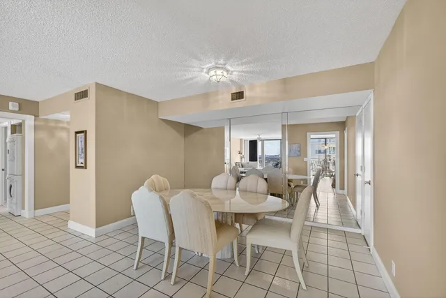 a view of a large yard with lots of tress in it