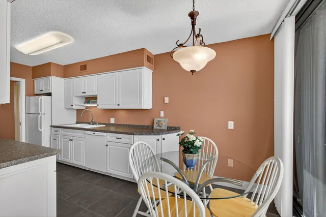 a bedroom with a bed and a lamp