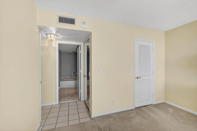 a bathroom with a sink toilet vanity and shower