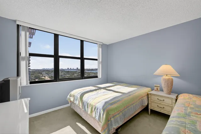 a view of a house with a swimming pool yard and sitting area