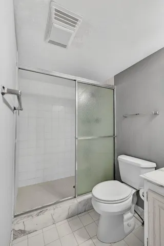 a view of a patio with a table chairs and a backyard