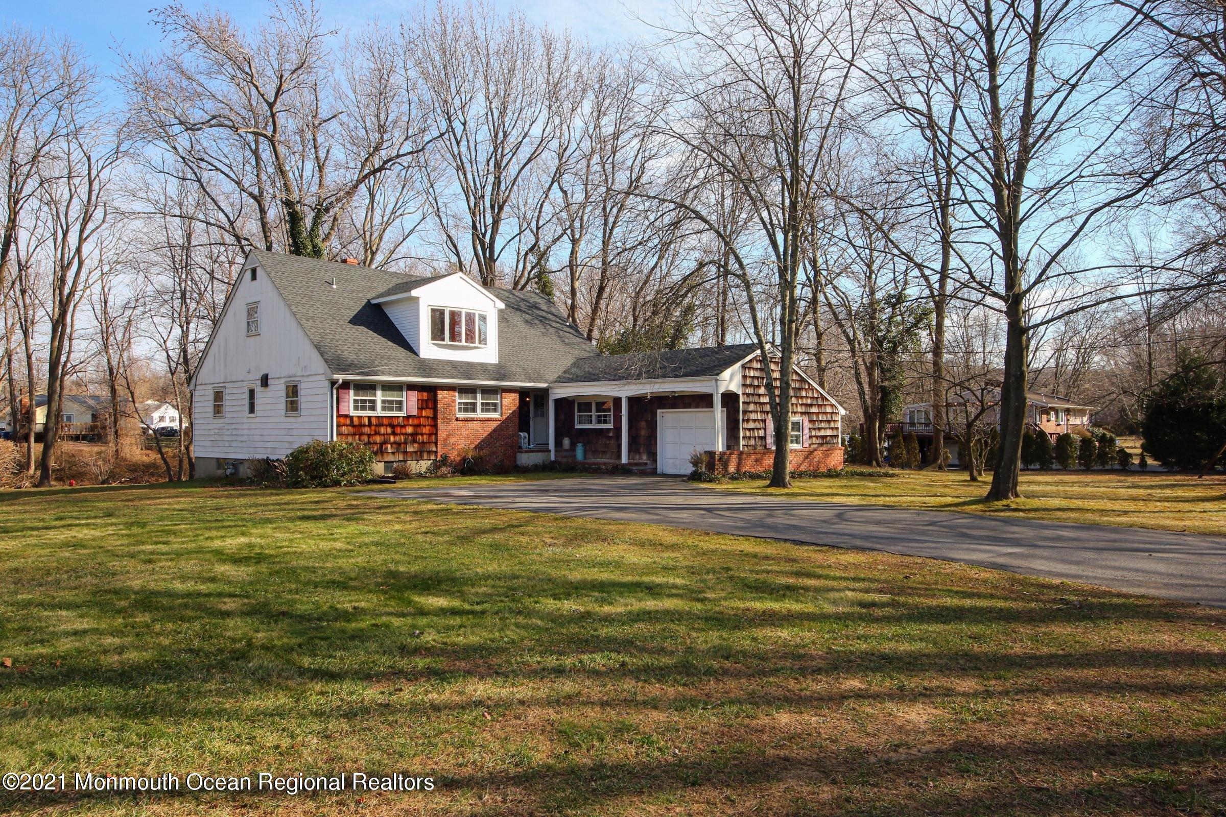 700 Hopping Road Belford, NJ 07718 - Photo 1 of 35 a front view of a house with a yard