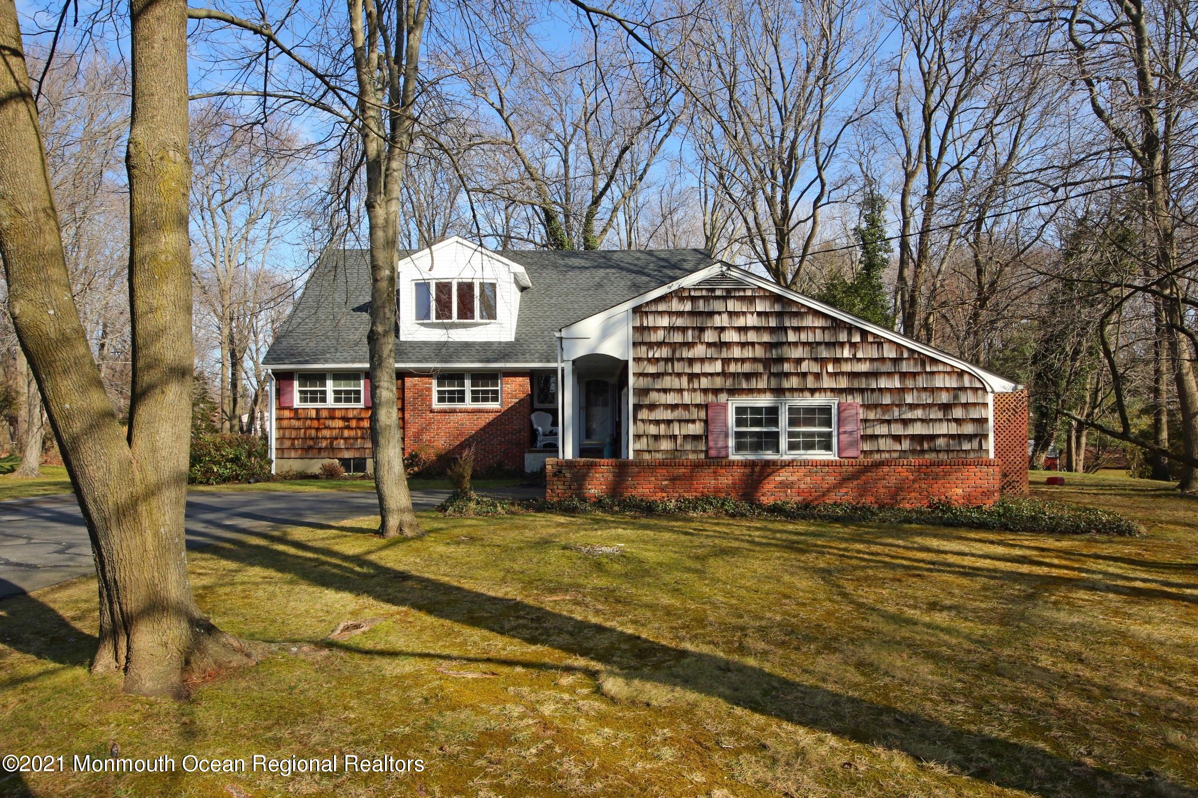 700 Hopping Road Belford, NJ 07718 - Photo 2 of 35 a front view of a house with a yard