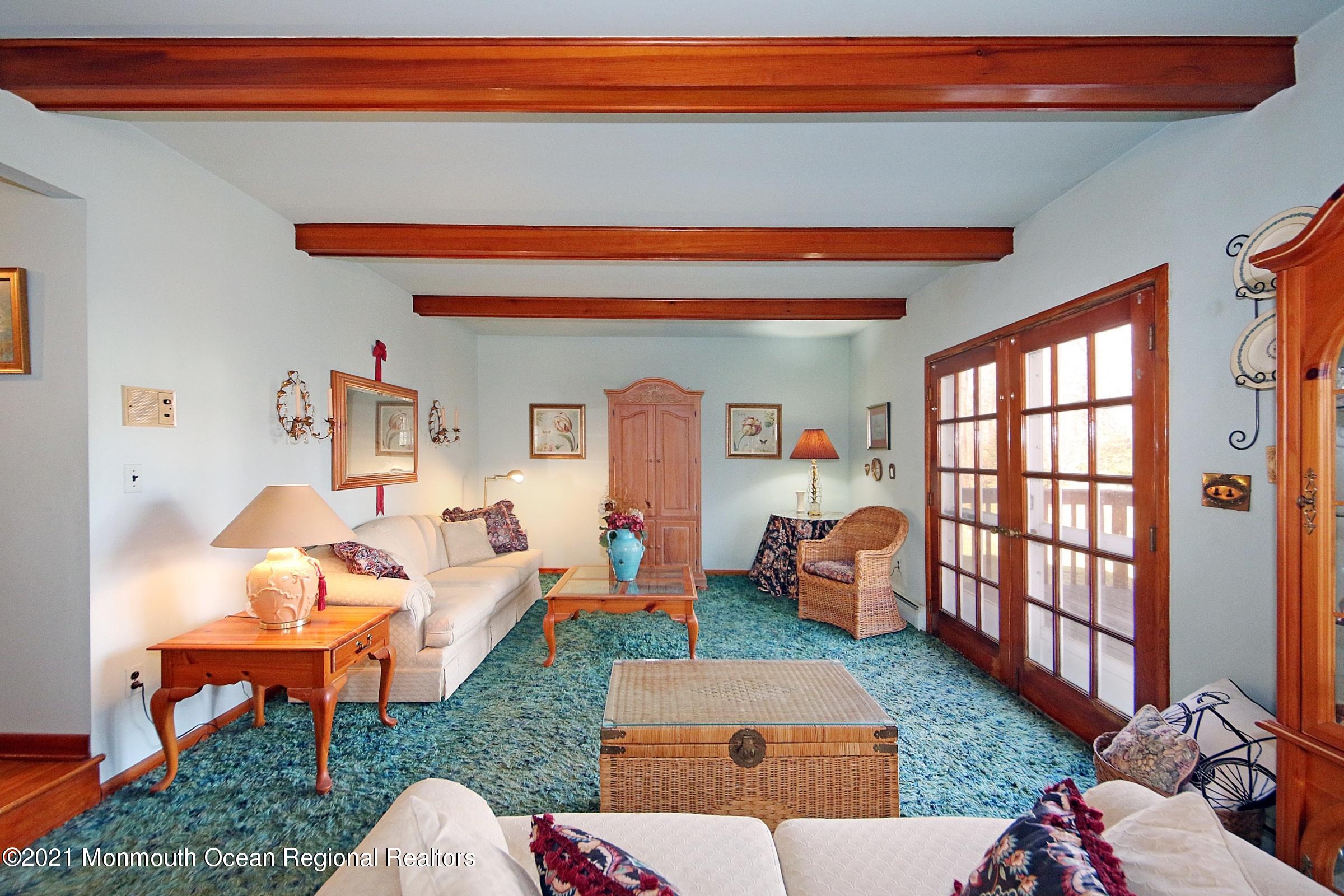 700 Hopping Road Belford, NJ 07718 - Photo 12 of 35 a living room with furniture a rug and a window