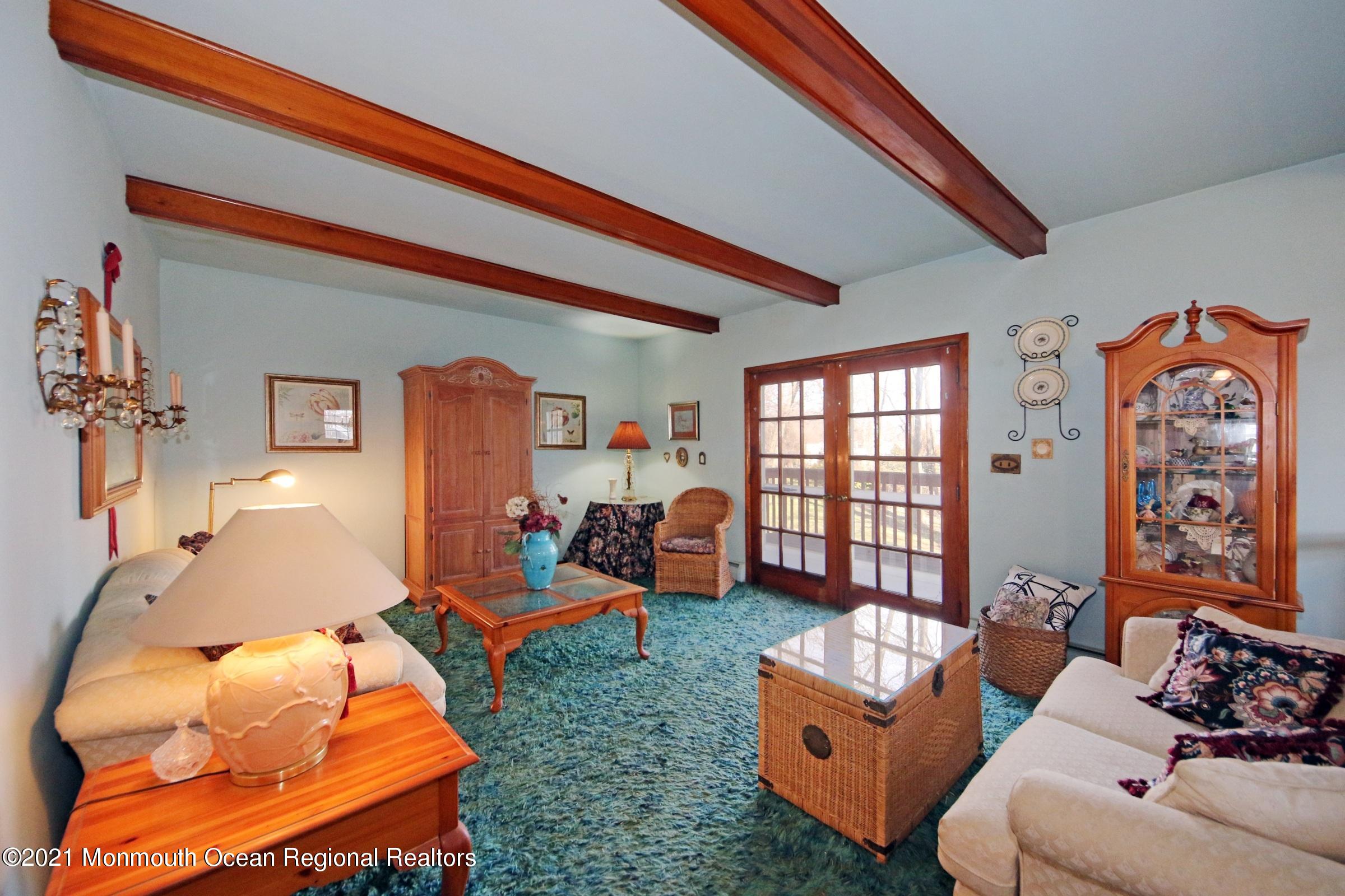 700 Hopping Road Belford, NJ 07718 - Photo 13 of 35 a living room with furniture and a large window