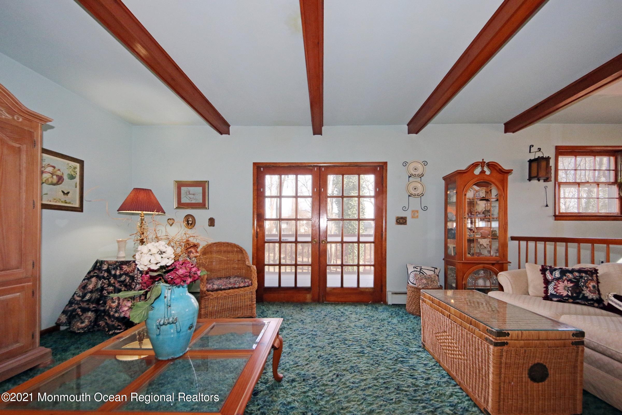 700 Hopping Road Belford, NJ 07718 - Photo 14 of 35 a living room with furniture fireplace and window