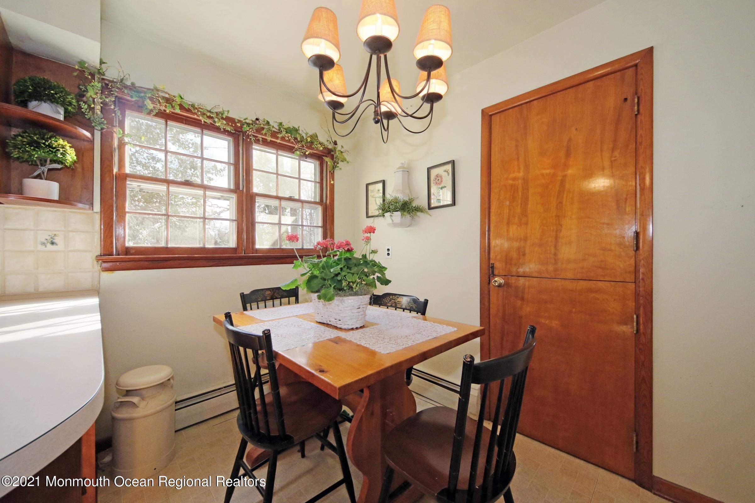 700 Hopping Road Belford, NJ 07718 - Photo 19 of 35 a view of a dining room with furniture window and outside view