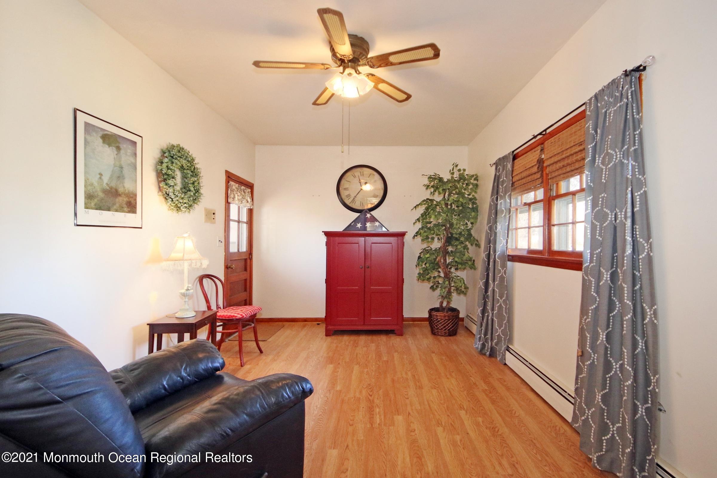 700 Hopping Road Belford, NJ 07718 - Photo 21 of 35 a living room with furniture and a window