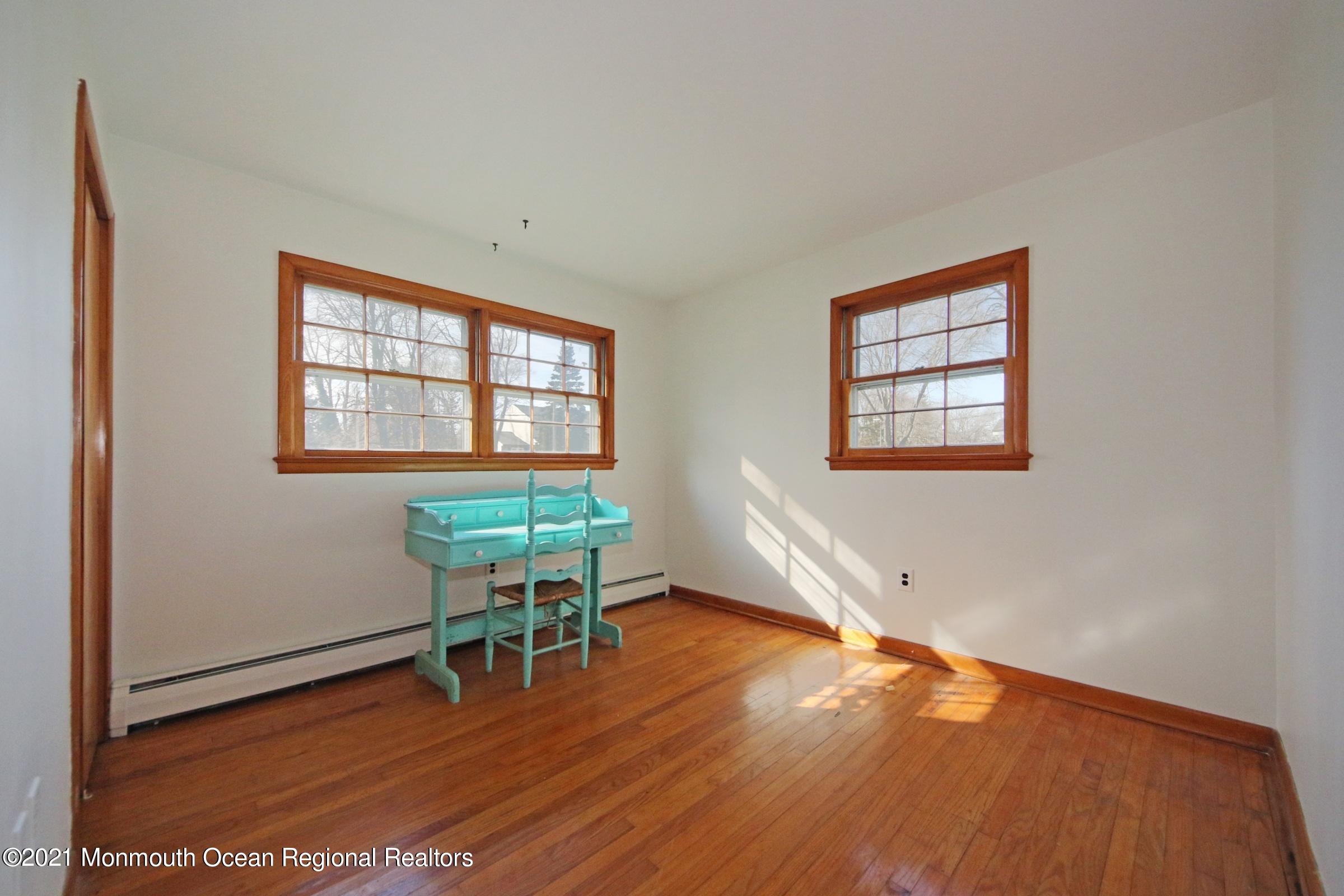 700 Hopping Road Belford, NJ 07718 - Photo 23 of 35 a workspace with wooden floor and a window
