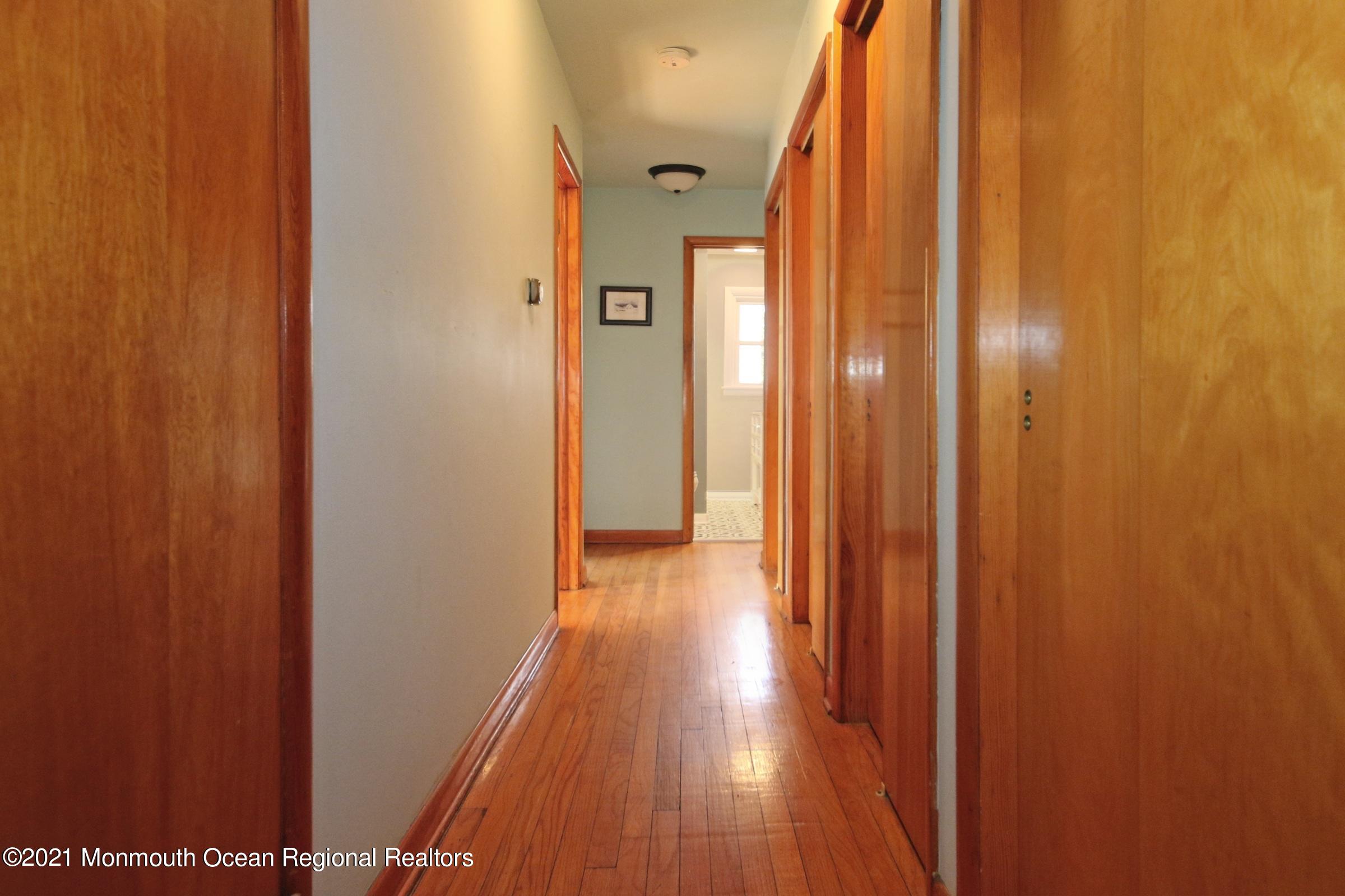 700 Hopping Road Belford, NJ 07718 - Photo 27 of 35 a view of a hallway with wooden floor