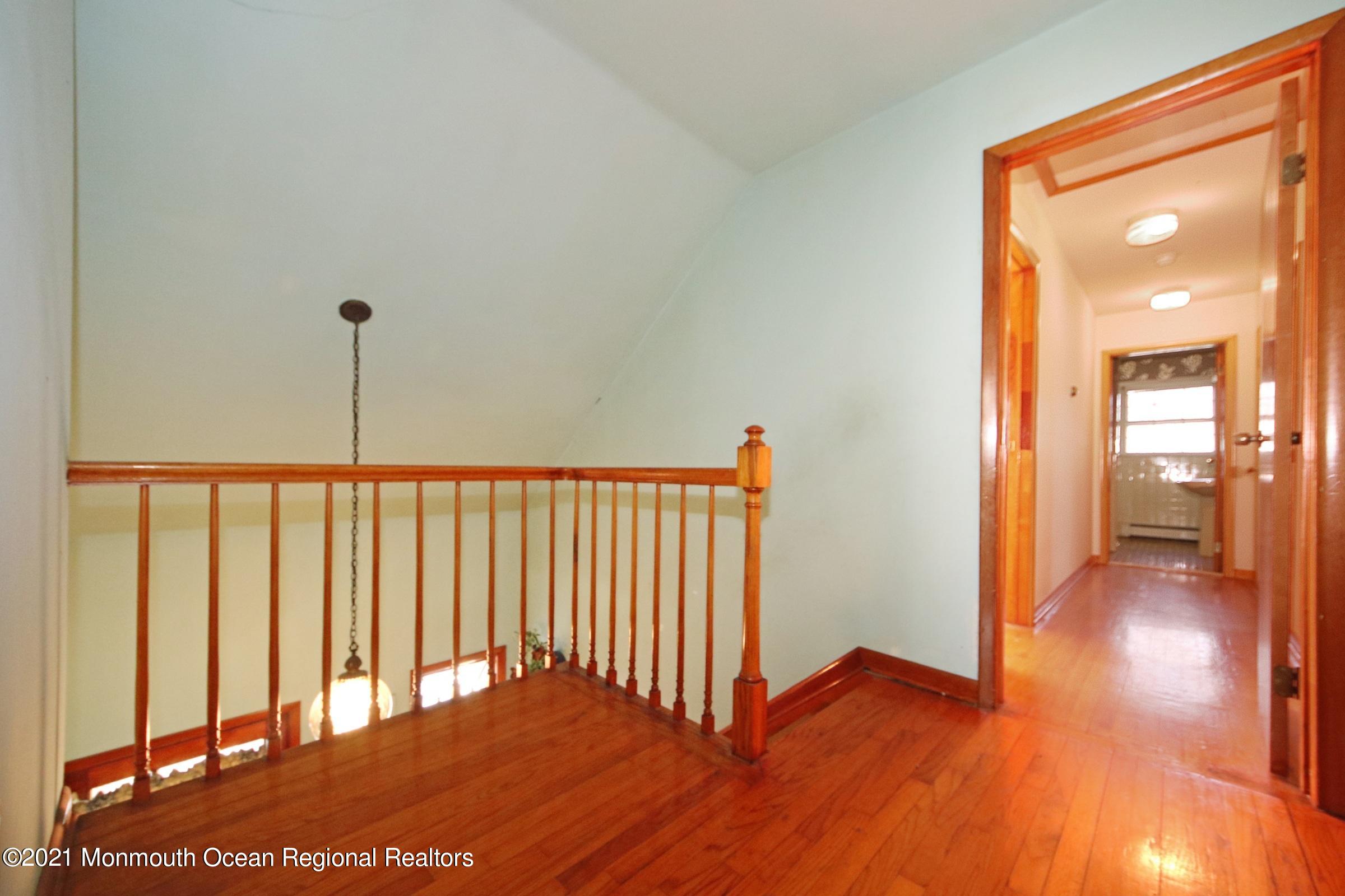 700 Hopping Road Belford, NJ 07718 - Photo 28 of 35 a view of hallway with wooden floor