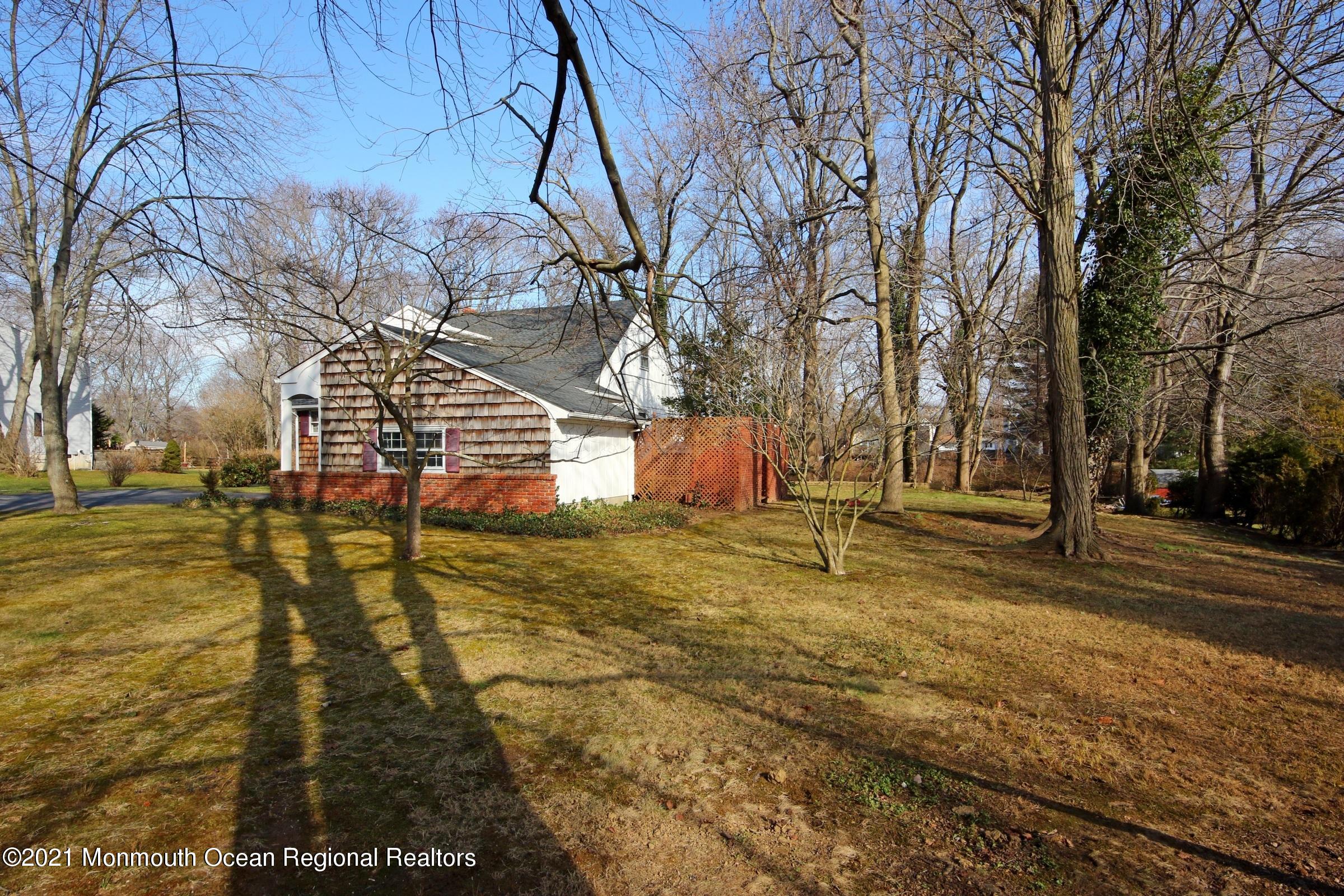 700 Hopping Road Belford, NJ 07718 - Photo 4 of 35 a view of a yard with basketball court