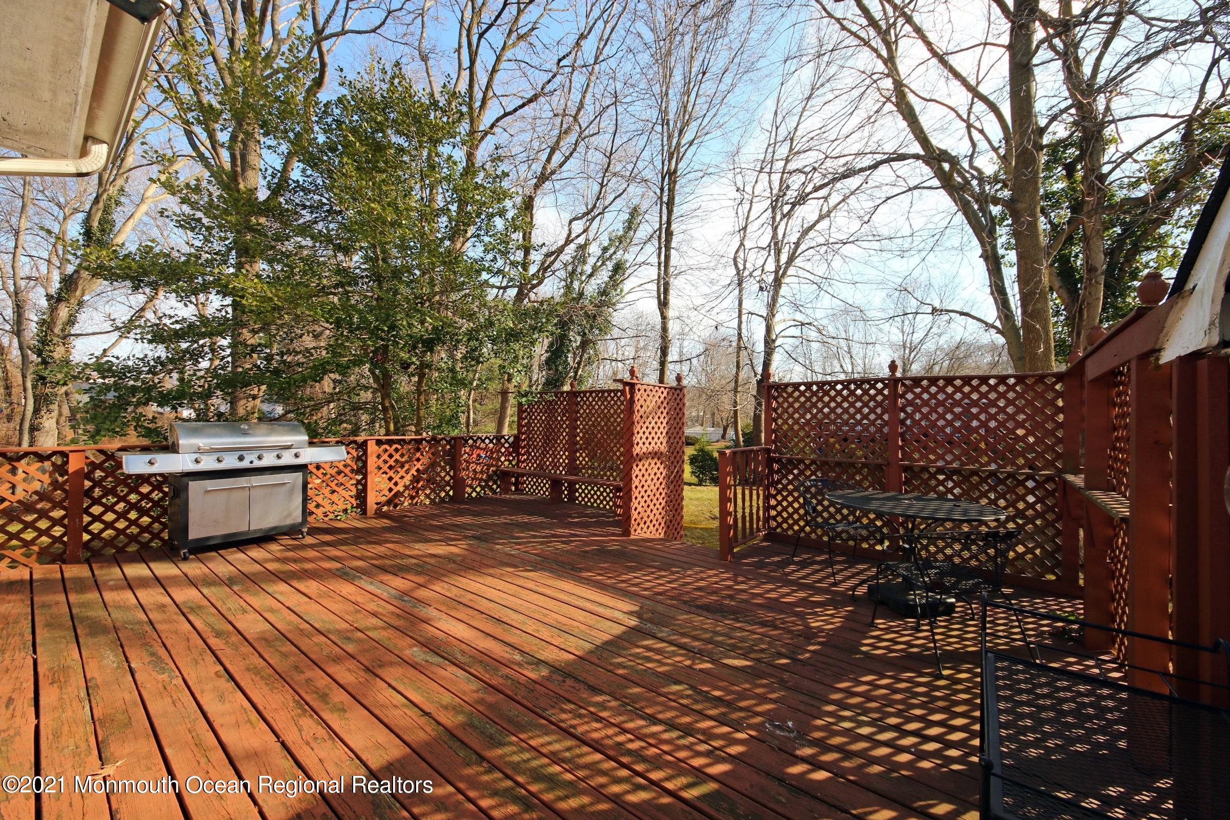 700 Hopping Road Belford, NJ 07718 - Photo 6 of 35 a view of a terrace with trees