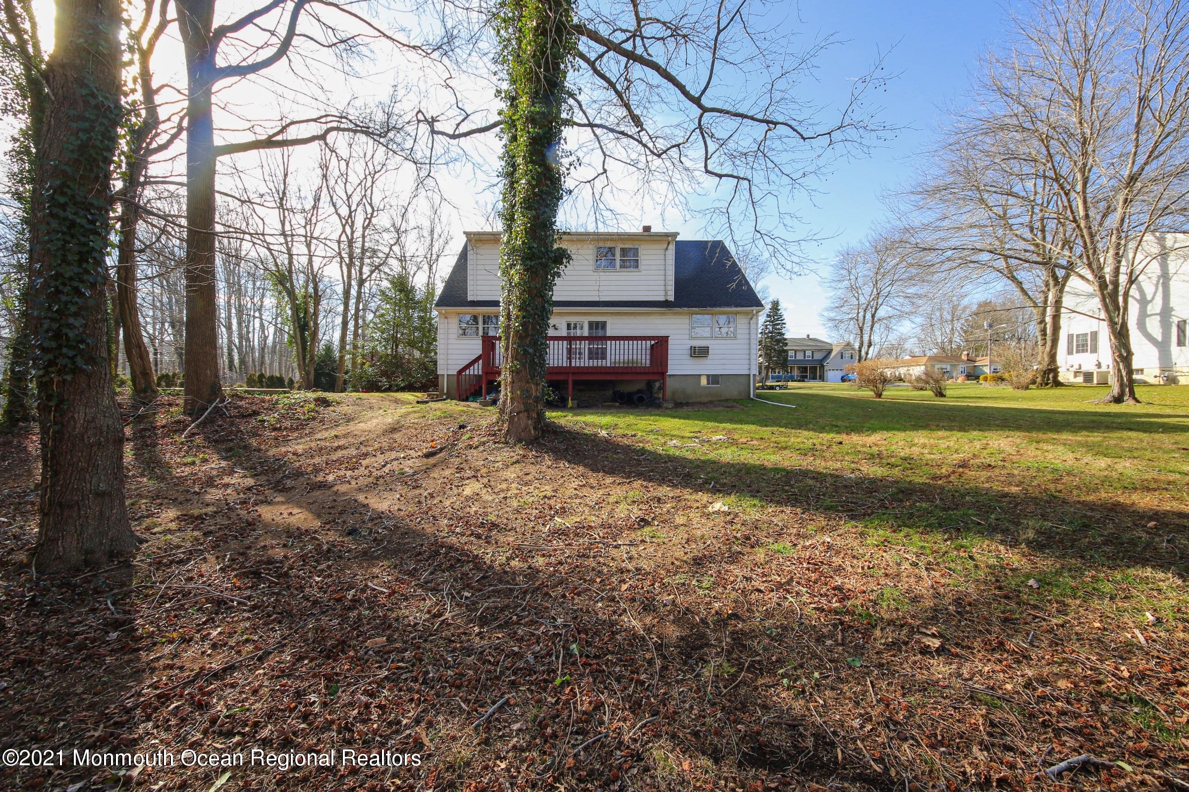 700 Hopping Road Belford, NJ 07718 - Photo 7 of 35 a view of a big yard next to a house