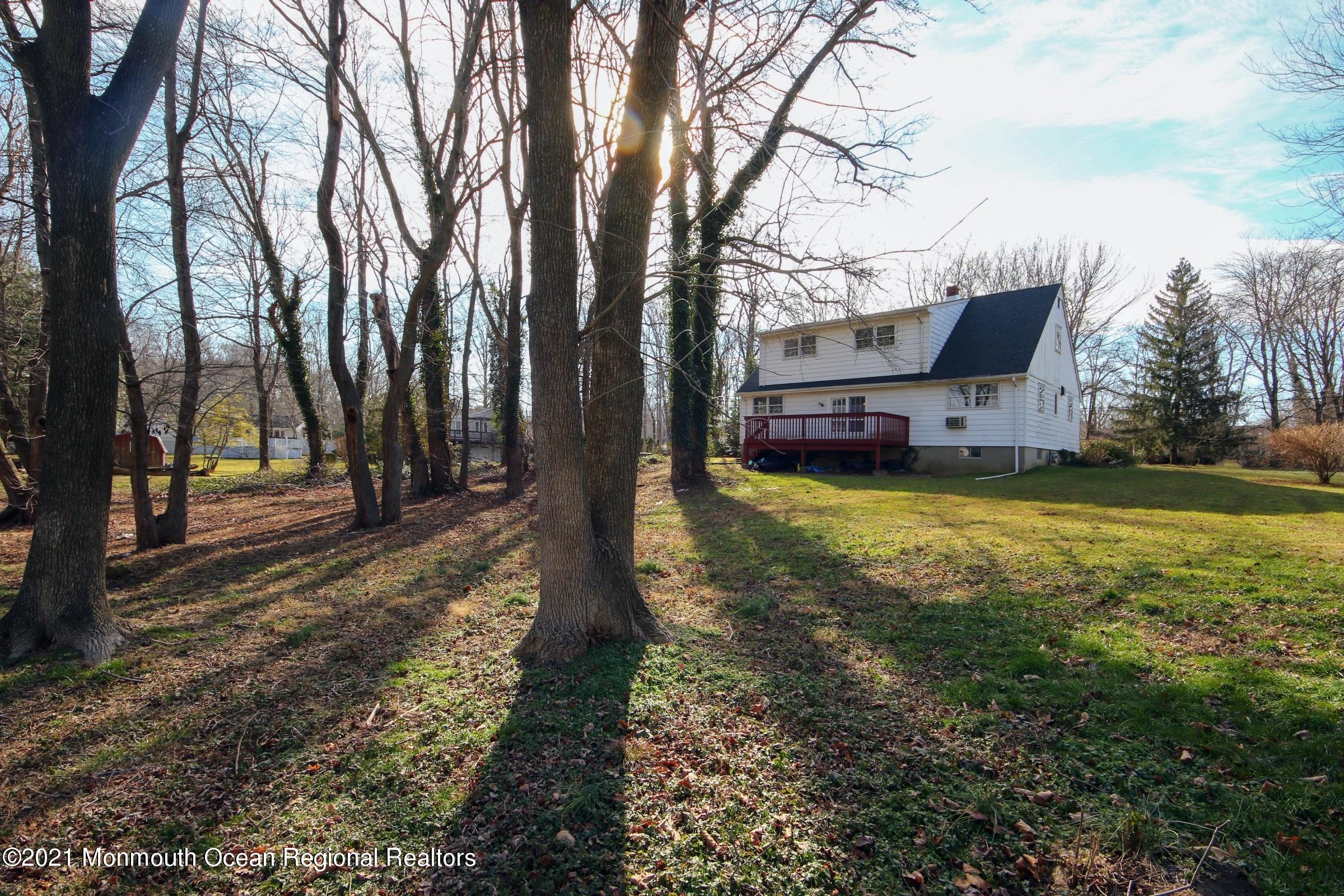 700 Hopping Road Belford, NJ 07718 - Photo 8 of 35 a view of a yard with a large tree