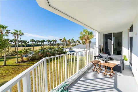 a view of balcony with furniture