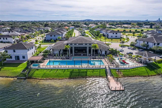 a front view of house with yard and mountain view in back