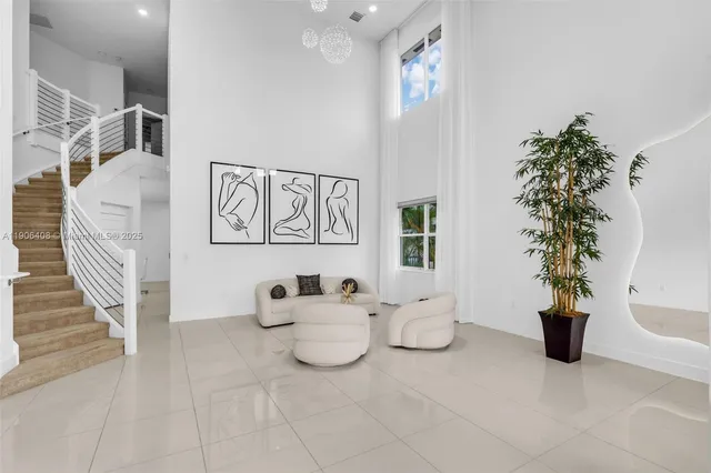 a living room with furniture and flowers