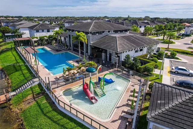 an aerial view of a house with a yard