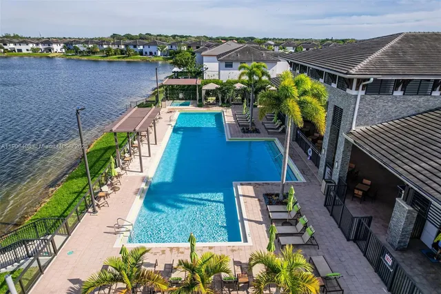 a view of a swimming pool with a patio