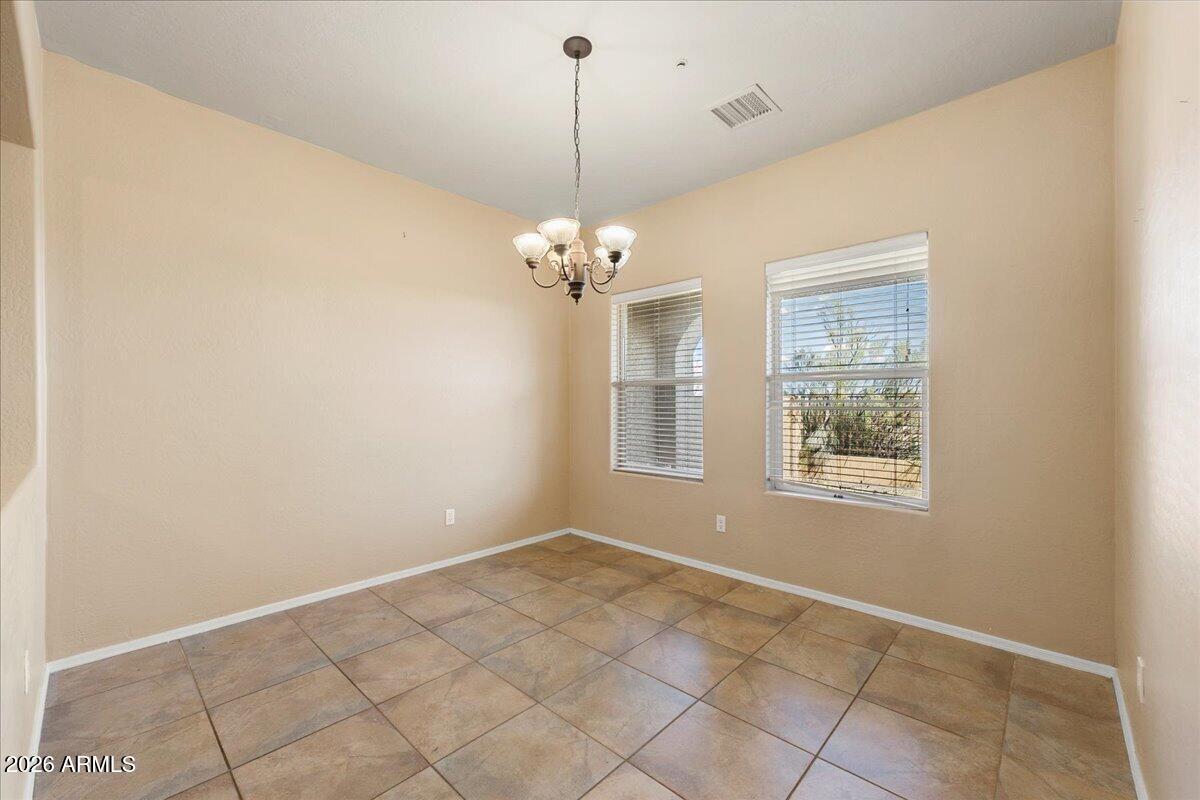 813 Alfonse Road Clarkdale, AZ 86324 - Photo 9 of 41 a view of a room with windows and chandelier