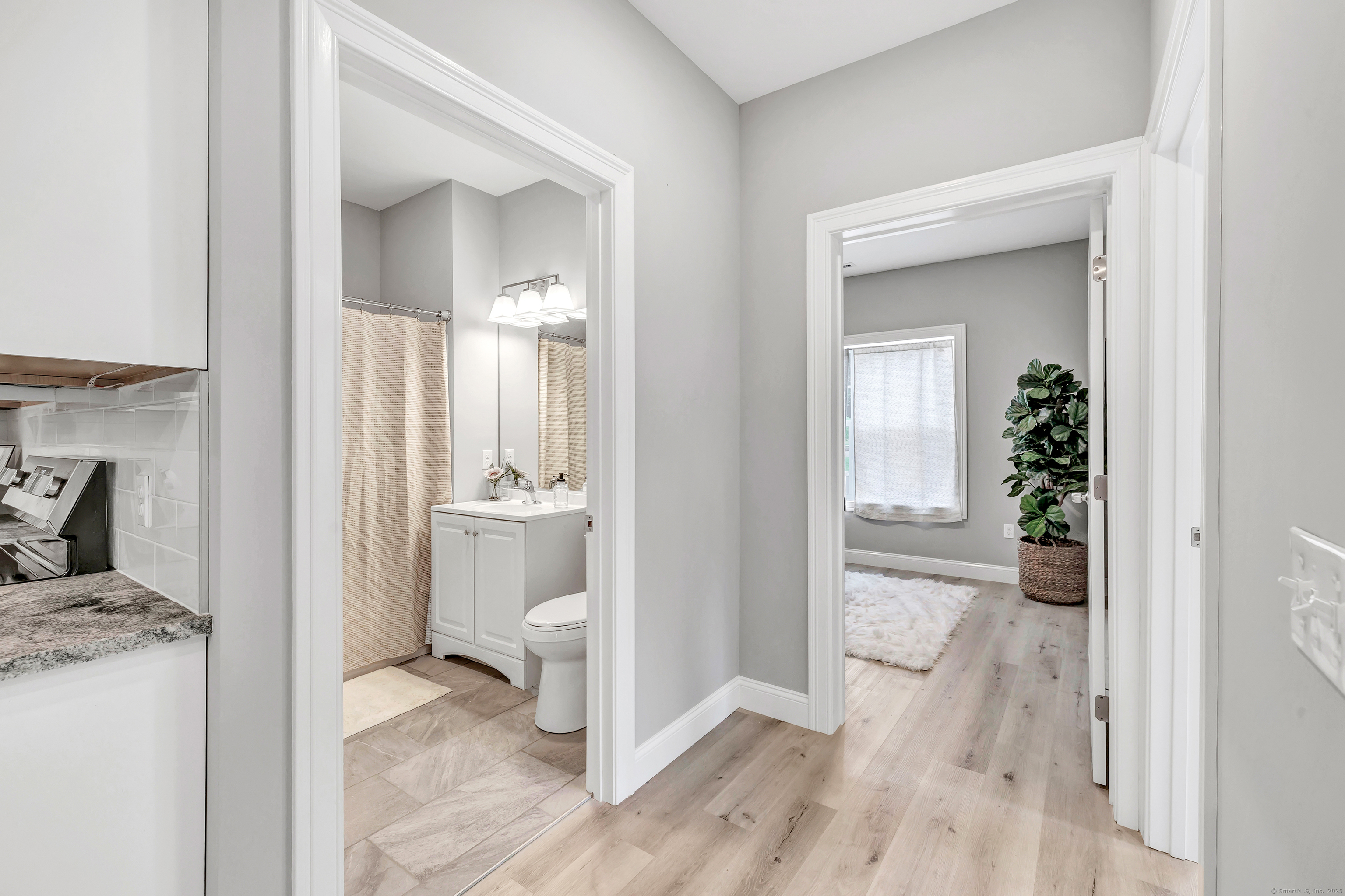 303 Bridgeport Avenue, Unit 205 Shelton, CT 06484 - Photo 15 of 36 a view of a bedroom from a hallway