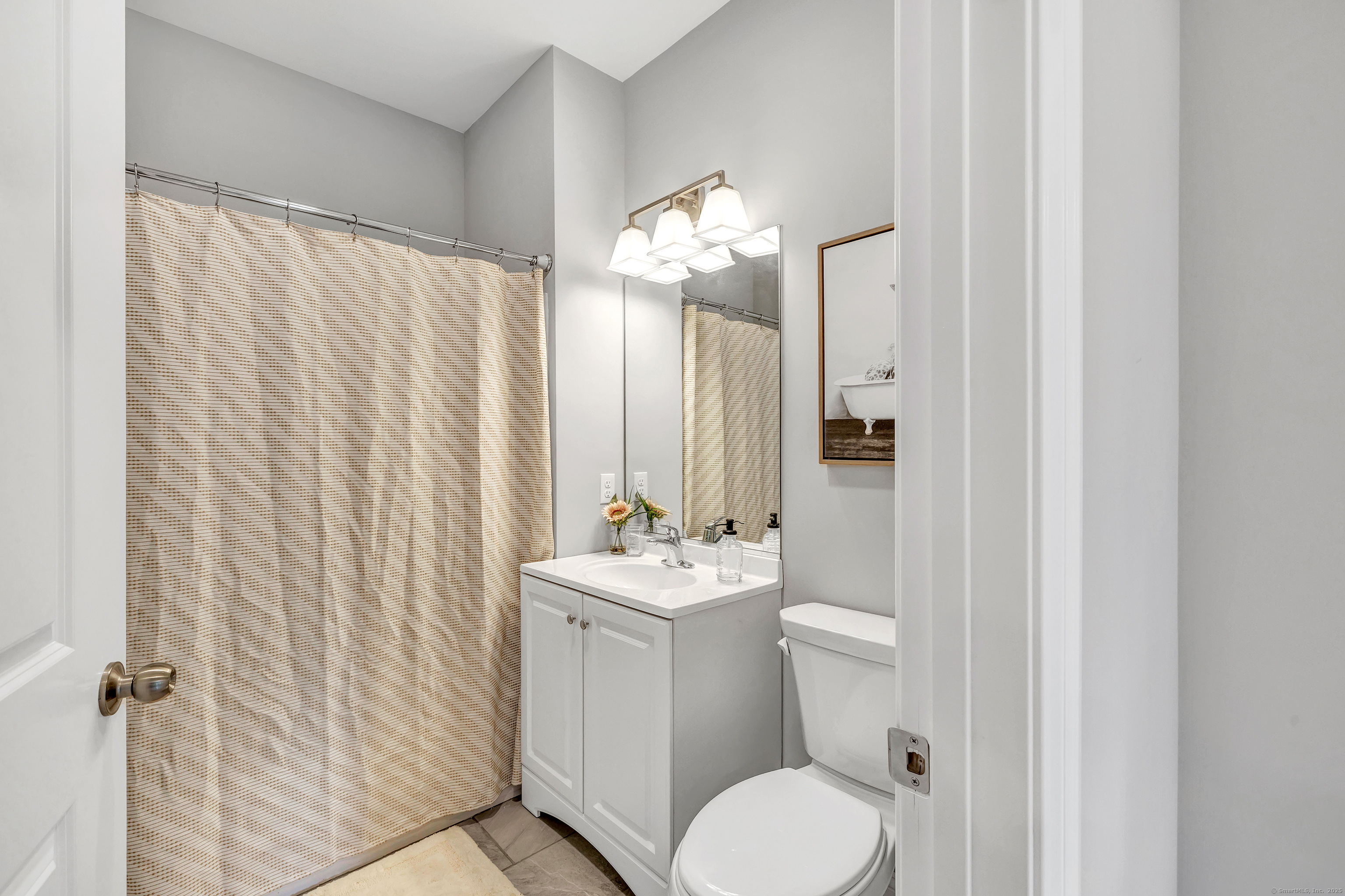 303 Bridgeport Avenue, Unit 205 Shelton, CT 06484 - Photo 16 of 36 a bathroom with a sink toilet and shower