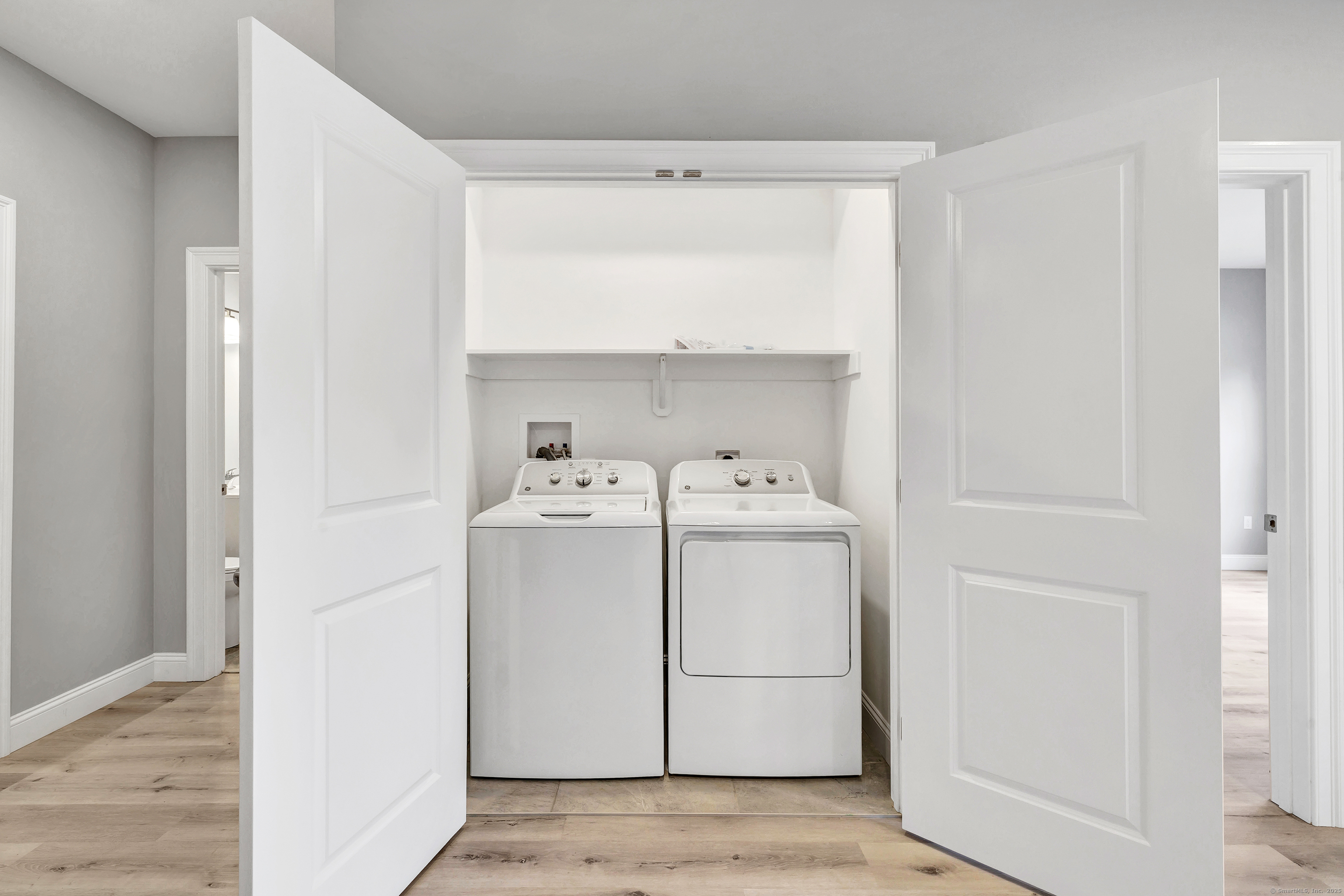303 Bridgeport Avenue, Unit 205 Shelton, CT 06484 - Photo 36 of 36 a utility room with dryer and washer