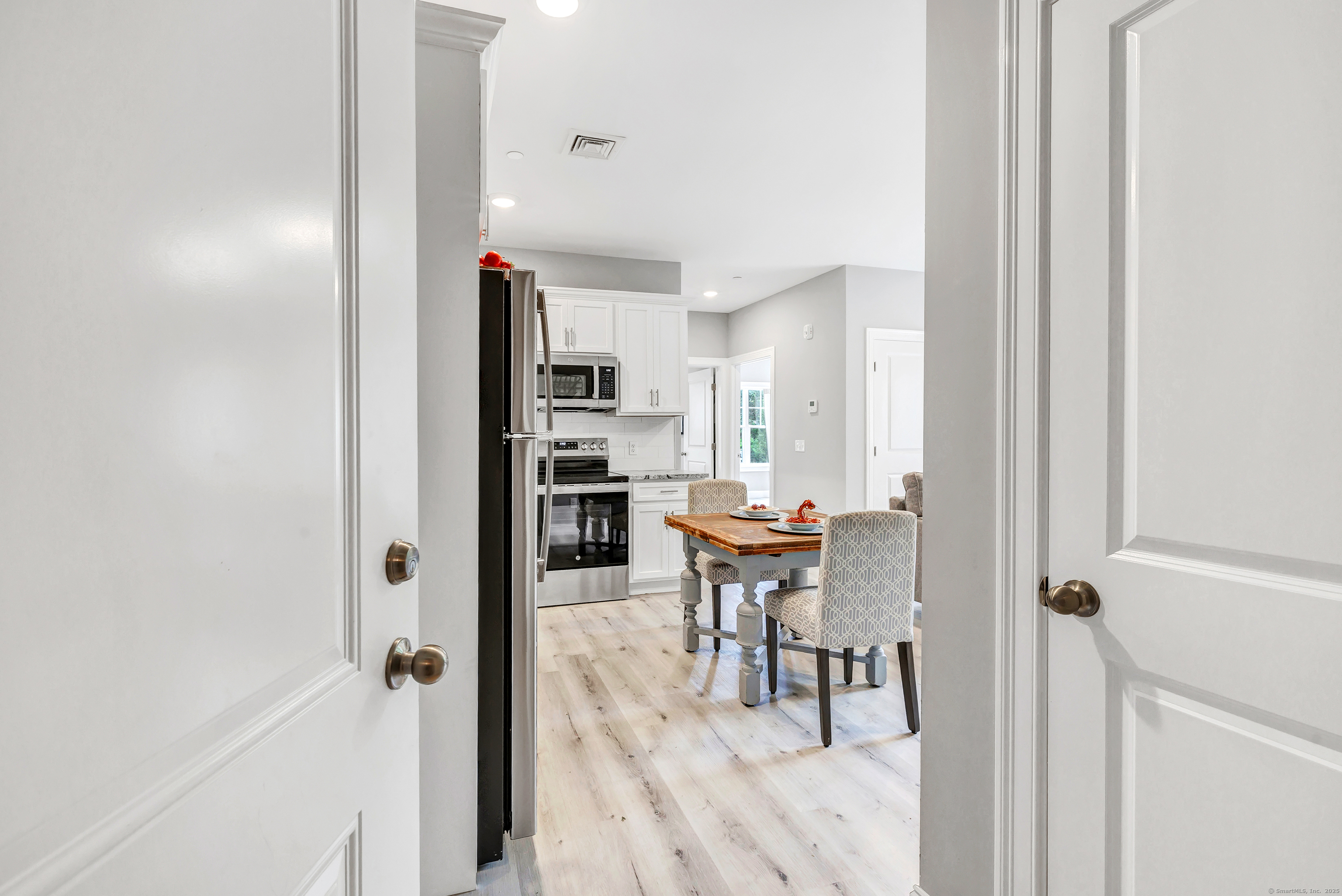 303 Bridgeport Avenue, Unit 205 Shelton, CT 06484 - Photo 4 of 36 a view of a room with breakfast area